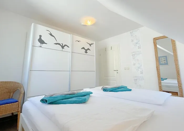 Апартаменты Am Kuestenwald 9 Seemoewe Козеров